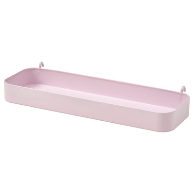 Un organitzador SKÅDIS de color rosa clar. La seva forma rectangular té una vora alta per a un emmagatzematge segur. Fabricat en acer recobert d'epoxi, s'enganxa a les superfícies.