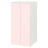 Un armari SMÅSTAD en blanc i rosa clar, amb dues portes de tancament suau.