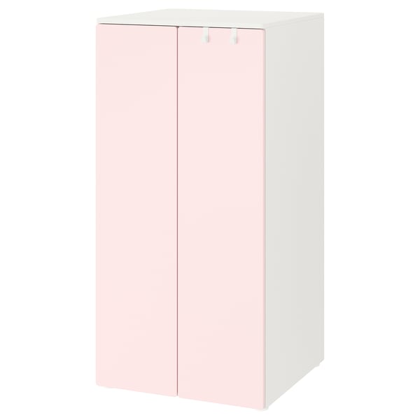 Un armari SMÅSTAD blanc i rosa clar per a nens, dret amb dues portes.