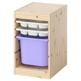 Moble d'emmagatzematge Ikea TROFAST amb fusta clara, contenidors morats, perfecte per a habitacions infantils.