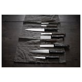 Ganivet negre i platejat sobre tela, diverses formes i mides, disseny professional.
