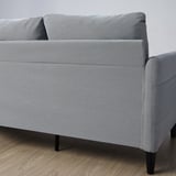 Gray three-seat sofa with side pockets, black legs.