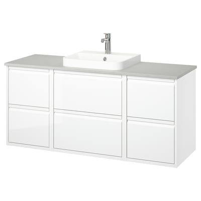 Modern white bathroom vanity by ÄNGSJÖN, sleek with drawer storage, light quartz countertop, single vessel sink, chrome fixtures.