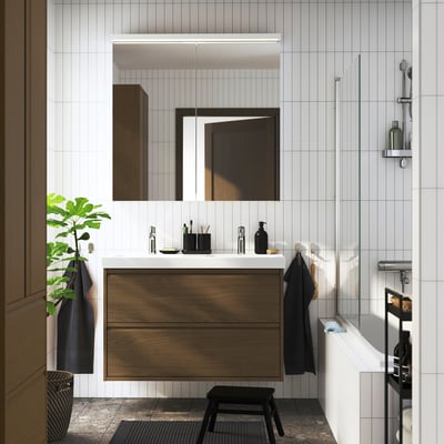 Brown oak double sink vanity, wall-mounted, sleek design, dark accents.