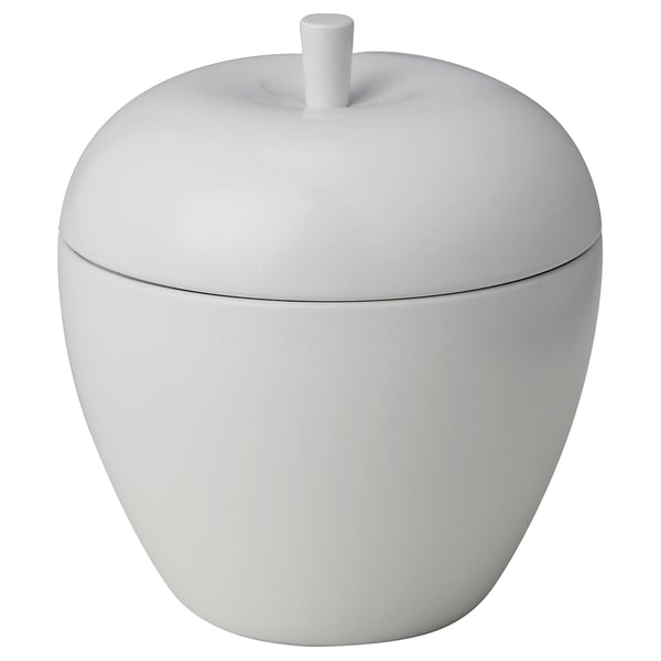 White ANSPRÅKSLÖS apple-shaped candle jar with lid, made of tinplate, holding a scented candle.
