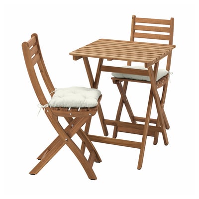 An ASKHOLMEN outdoor dining set with a brown wooden table and folding chairs with beige cushions.