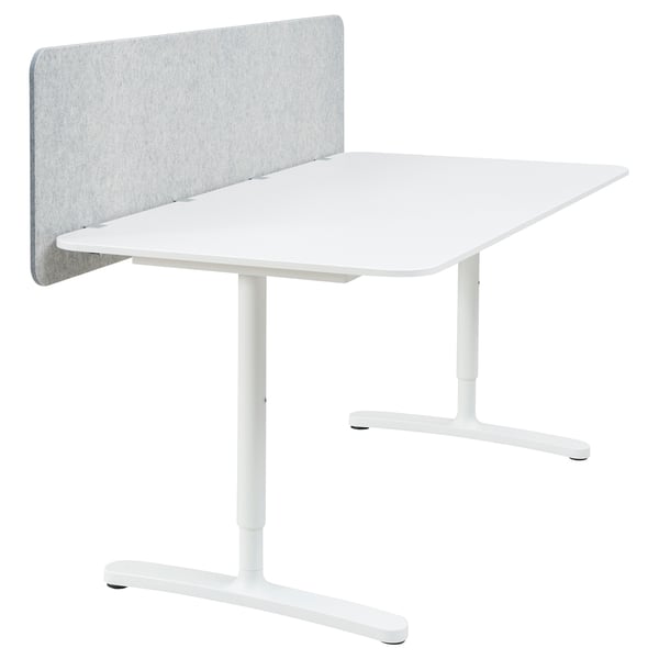 White BEKANT adjustable desk with gray sound-absorbing screen.