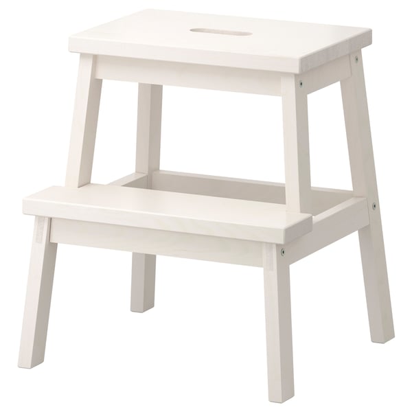 This image shows a BEKVÄM step stool, white in color, made of solid aspen wood, featuring a rectangular shape with two steps and a flat top.
