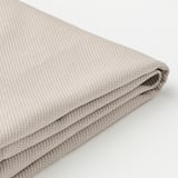 Folded fabric stool cushion, soft textured, beige colored.
