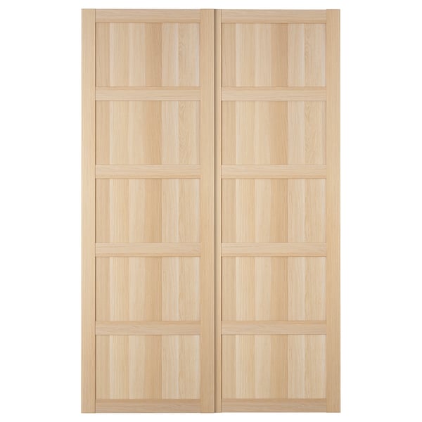 IKEA BERGSBO light oak sliding doors with a modern, square design. No knobs needed, perfect for tight spaces.