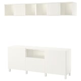 This image shows a white BESTÅ tv storage unit. It a combination of open and closed storage with a sleek, modern design.