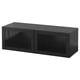 A black BESTÅ storage unit with glass doors. It a sleek, rectangular design with a smooth finish.