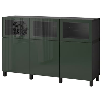 Green BESTÅ sideboard with adjustable shelves and glass doors for storage and display.