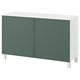 White BESTÅ sideboard with green accents, two doors, adjustable shelves, four white legs.