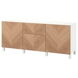 A white and wood grain sideboard, named BESTÅ, with multiple storage compartments.
