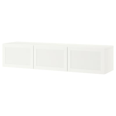 A white BESTÅ tv bench with three doors, offering storage and cable management.