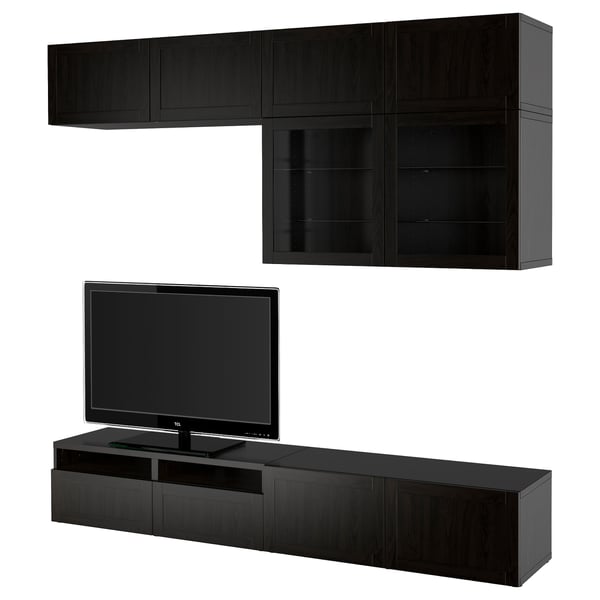 Modern black entertainment center with wall and base units, housing tv, with sleek design and storage spaces.