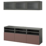Modern grey & reddish-brown tv storage. Wall cabinet with glass doors, tv bench with shelves & drawers. Sleek & functional design.