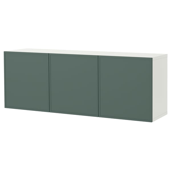 A white and green BESTÅ wall-mounted cabinet. It has three green doors and offers airy storage.