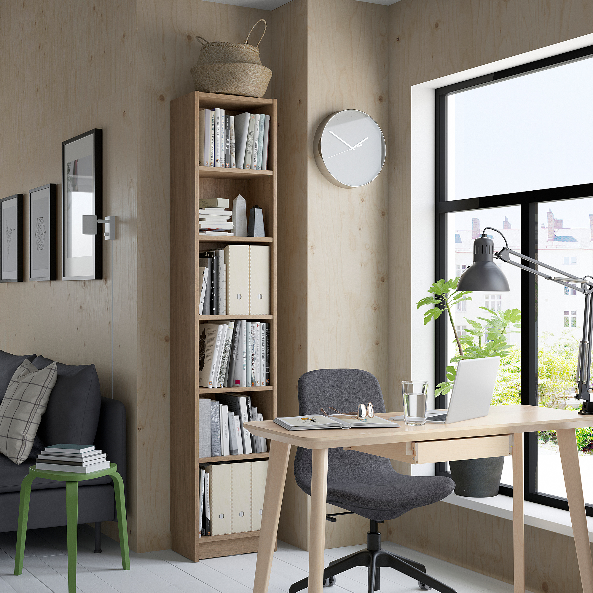 Modern office with BILLY bookcase, laptop desk, and cozy decor.