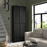Large black BILLY bookcase; tall, fits under stairs, near window, matches modern room decor.