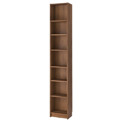 A tall, wooden BILLY bookcase in a light brown color, featuring open shelves for storage.