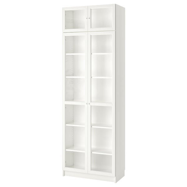 A white ikea BILLY bookcase with glass doors, tall and rectangular, featuring adjustable shelves.
