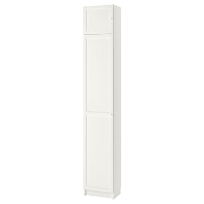 This image shows a white BILLY bookcase, a vertical storage unit with two adjustable shelves behind panel doors.