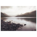 BJÖRKSTA frame-less canvas: foggy mountains reflect over calm lake, rocks in foreground, nature scenery.