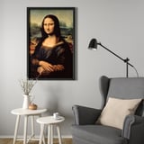 A framed iconic portrait in a modern sitting area with a grey chair and small tables, creating a sophisticated atmosphere.