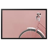 Pink bikes front wheel and handlebar, black framed photo.
