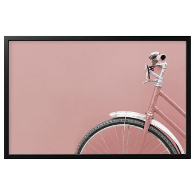 Pink bikes front wheel and handlebar, black framed photo.