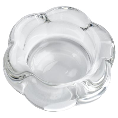 Clear glass tealight holder, flower-shaped, modern design.