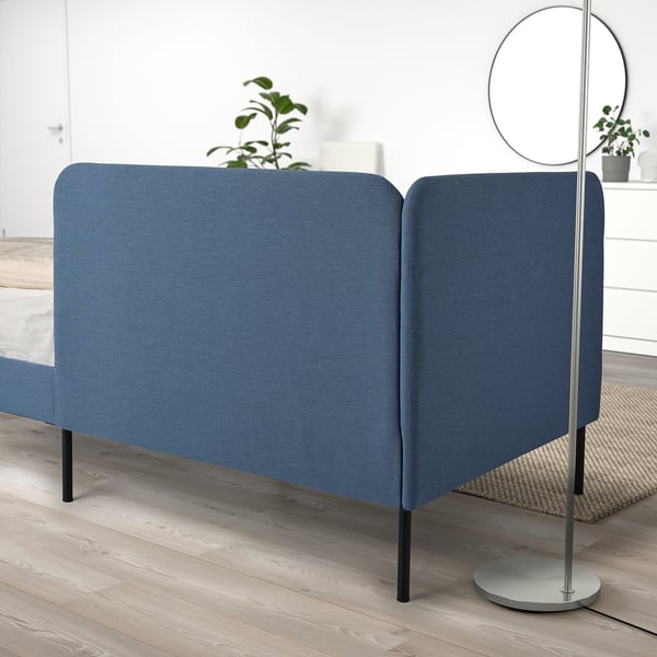 BLÅKULLEN blue couch-bed combo, modern design, fits small spaces, with upholstered headboard & wooden floor setting.