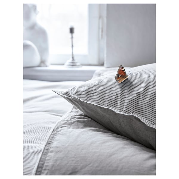 Gray striped bed sheets with a butterfly, crisp and cozy, cotton fabric.