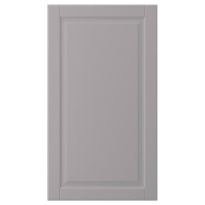 A grey BODBYN cabinet door with a smooth, bevelled panel design in fibreboard.