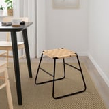 BOESKIL stool: black, woven jute seat, compact, indoor use. Sits beneath table, smaller than chairs.