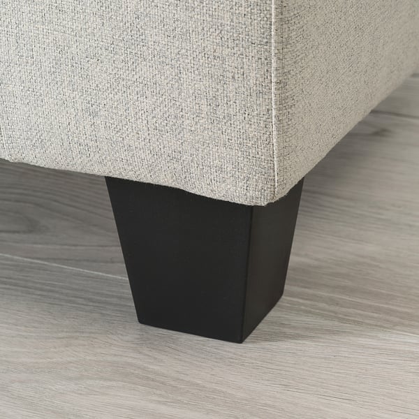 A modern sofa with a sleek, dark wooden leg and light gray cushioned seat, showcasing high-quality design and comfort.