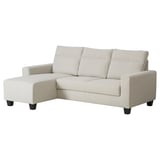 A BOLLSTANÄS sectional sofa in light gray fabric with a chaise lounge on the left side, providing a cozy and supportive seating area.