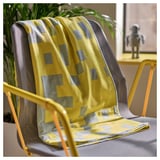 BRÄNNBOLL yellow blanket with gray squares on a gray chair, larger than the chair, soft, recycled polyester.