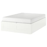 White BRIMNES bed frame with hidden storage, sleek design, and wooden construction.