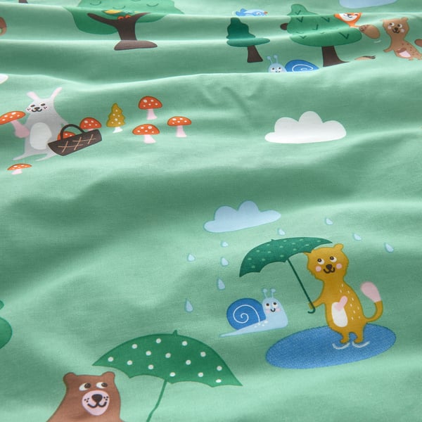 Adorable forest creatures on soft, green fabric kids duvet.