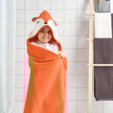 Child in orange fox towel with hood, post-bath. Warm, secure, absorbent, quick-drying, comfortable. Wooden ladder with towels.