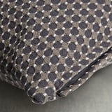 Geometric patterned cushion cover with zipper, woven in muted tones, designed to fit a 50x50 cm inner cushion.