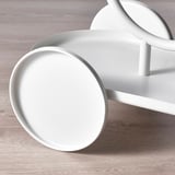 Modern white plant stand with circular shelves, clean lines, and wheels, ideal for displaying multiple plants.