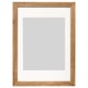 A wooden picture frame named DALSKÄRR, featuring light brown oak finish, rectangular shape, and front plastic protection.