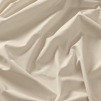 Cream-colored pre-cut cotton fabric for sewing projects.