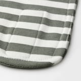 Close-up of soft, striped green and white cotton headband with adjustable fastener. Textured fabric, neat stitching.