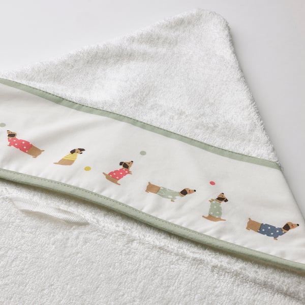 Fluffy white baby towel with cute dog prints, green trim, and hood. High-quality material, soft and absorbent.