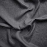 Dark grey linen curtains, textured, draped, natural folds, soft yet firm, breathable fabric.